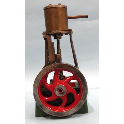 688 - A single-piston vertical stationary engine with flywheel, unmarked, 19.5cm.