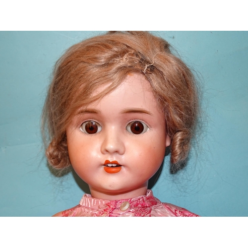 63 - A Schoenau & Hoffmeister bisque-head doll with sleeping blue eyes, mohair wig and jointed compos... 