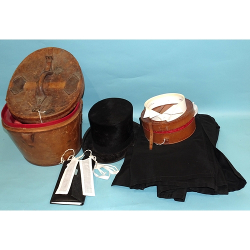 66 - A silk top hat by Tress & Co, London, in leather hat box, a barrister's gown, starched wing coll... 