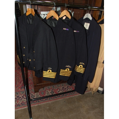 104 - Two Royal Navy uniforms, a dress suit and other items.