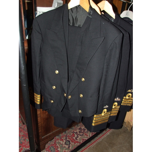 104 - Two Royal Navy uniforms, a dress suit and other items.