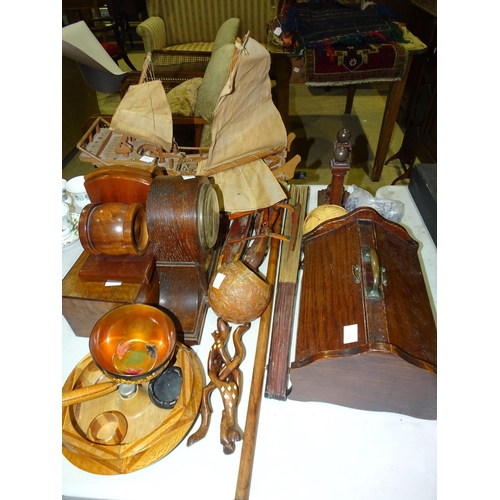 120 - A wooden model of a junk, a pair of wooden bookends, a striking mantel clock and other wooden items.... 