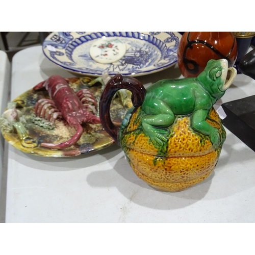 125 - A Continental majolica jug in the form of a frog astride a fruit, a modern majolica lobster dish, a ... 