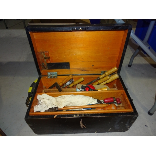 129 - A small stained wood tool box, together with a collection of woodworking tools.