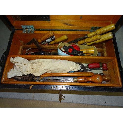 129 - A small stained wood tool box, together with a collection of woodworking tools.