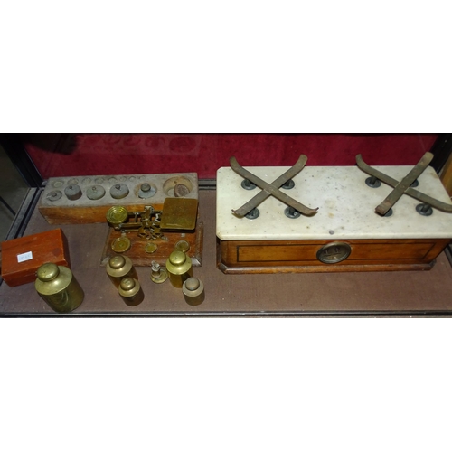 137 - A collection of various apothecary weights, postal scales and kitchen weighing scales, (dishes lacki... 