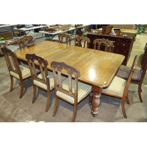 14 - A Victorian 'pull-out' extending dining table, 122 x 210cm and a set of nine oak dining chairs with ... 