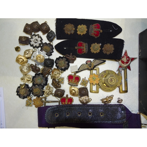 155 - A Scots Guards brass belt buckle, various military badges, etc.