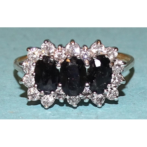 184 - A 9ct gold ring set a cluster of three sapphires and synthetic white stones, size R, 2.7g.... 