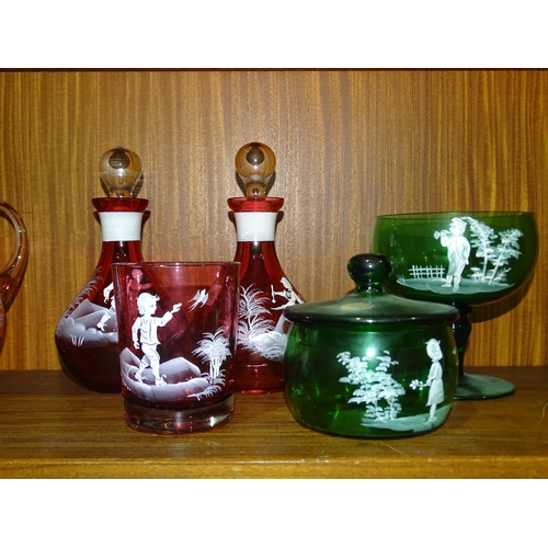 46 - Six pieces of cranberry glass with Mary Gregory-style decoration, together with two pieces of simila... 