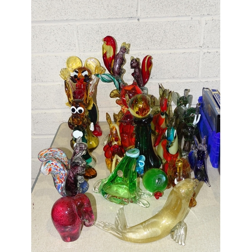 52 - A collection of eighteen Murano and other glass animal figures, including squirrels, elephants, seal... 