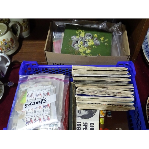 59 - An Edwardian autograph album, a small collection of postcards, tea card albums, postage stamps and o... 