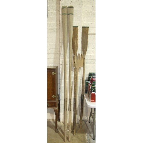 11 - Two sets of wooden oars, 257cm and 218cm long.