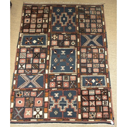 27 - A modern wool and flatweave rug of oblong and square panel design, 228 x 162cm.