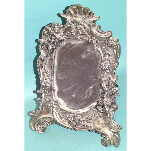 161 - A modern sterling silver shaped mirror with cherubs and floral decoration, stamped Sterling Silver, ... 