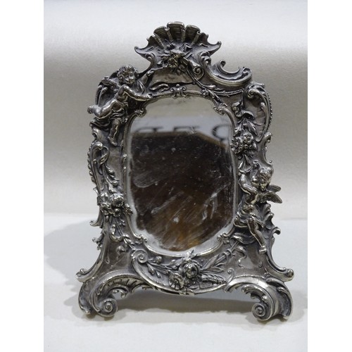 161 - A modern sterling silver shaped mirror with cherubs and floral decoration, stamped Sterling Silver, ... 