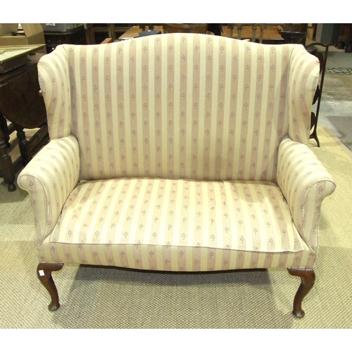 81 - A Georgian-style mahogany two-seater wing settee on cabriole front legs, 124cm wide.... 