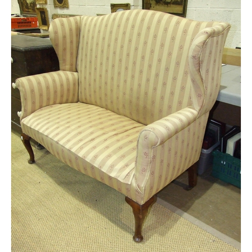 81 - A Georgian-style mahogany two-seater wing settee on cabriole front legs, 124cm wide.... 