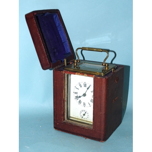 117 - An early-20th century French brass carriage clock, the white enamel face having Roman numerals above... 