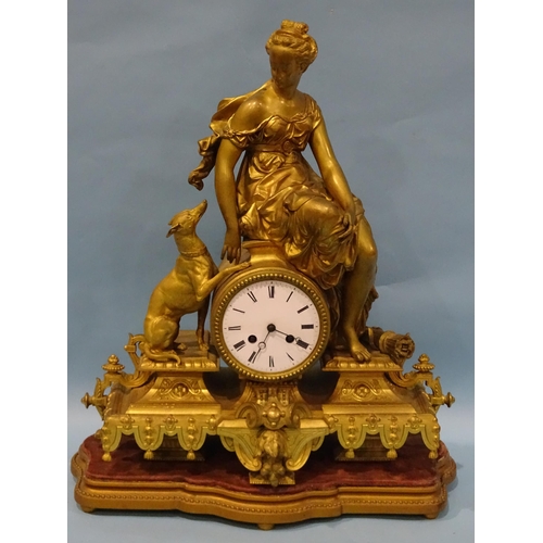 118 - A Victorian gilt spelter mantel clock, the central drum shape clock movement, with enamel dial surmo... 