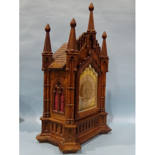 119 - A late-19th/early-20th century oak bracket clock, the architectural Gothic case enclosing a gong-str... 