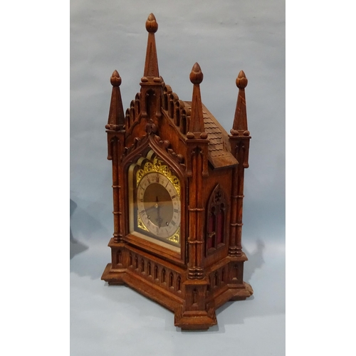 119 - A late-19th/early-20th century oak bracket clock, the architectural Gothic case enclosing a gong-str... 