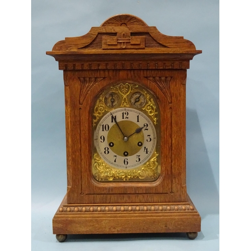 122 - An Edwardian oak-cased mantel or bracket clock, the movement striking on four chimes and a gong, the... 