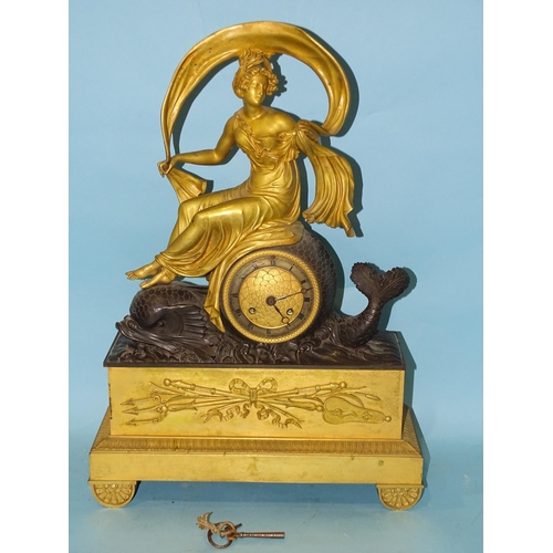 125 - An early-19th century gilt and bronzed metal mantel clock in the form of Aphrodite riding a dolphin,... 