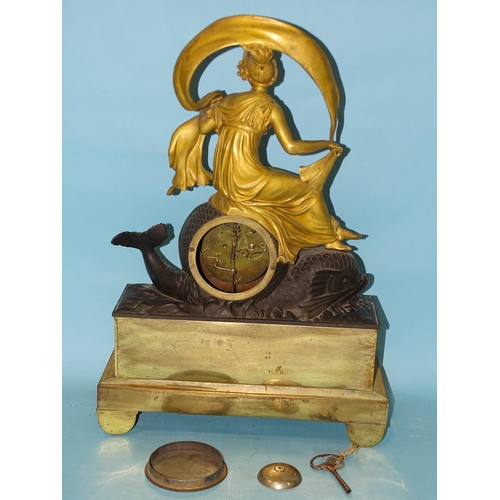 125 - An early-19th century gilt and bronzed metal mantel clock in the form of Aphrodite riding a dolphin,... 