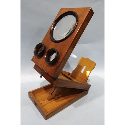 131 - A mahogany or walnut stereo-graphoscope with three lenses and folding viewing box.