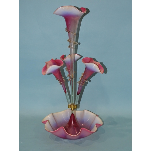 141 - A late-19th century pink and opaline glass epergne, the central trumpet vase flanked by three furthe... 