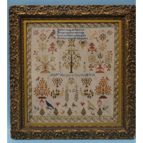 143 - A 19th century needlework sampler by Margaret Smyth, having a rhyme above an arrangement of trees, b... 