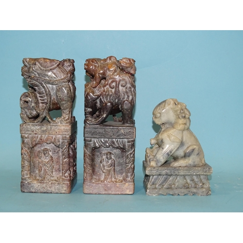 145 - A pair of late-19th/early-20th century soapstone seals or printing blocks carved with temple dogs an... 