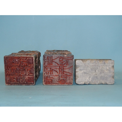 145 - A pair of late-19th/early-20th century soapstone seals or printing blocks carved with temple dogs an... 