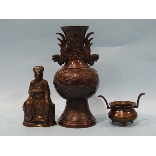 146 - A bronze model of a Chinese seated figure, 15cm high and other items.