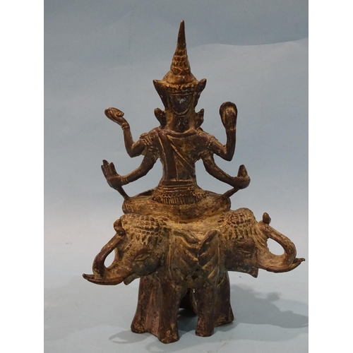 148 - An Asian bronze and metal finial depicting Shiva? seated on three elephants, 22.5cm high.... 