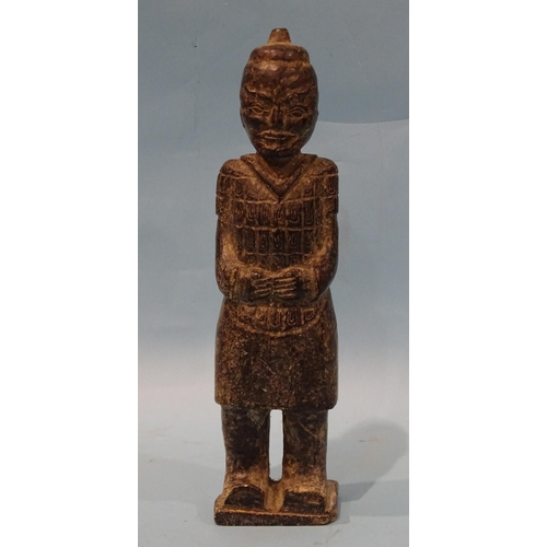 163 - A carved stone figure of a Chinese warrior in the style of a Terracotta Army figure, 25cm high.... 