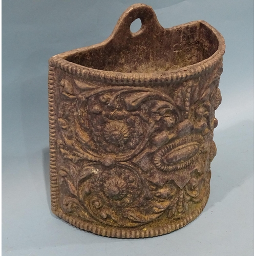 166 - A wall-mounted half-round lead planter with embossed foliate decoration, 25cm high, 22cm wide.... 