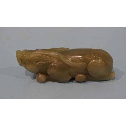 174 - A jade stylised model of a water buffalo crouching on its haunches, 9.5cm long.