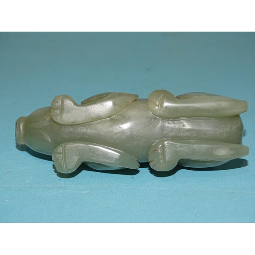 174 - A jade stylised model of a water buffalo crouching on its haunches, 9.5cm long.