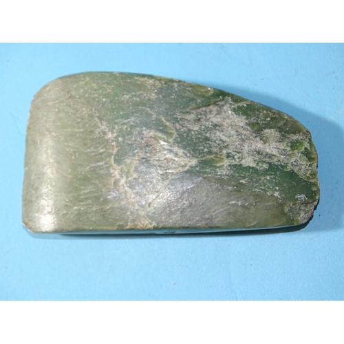 176 - A carved green hardstone axe head, 12.5 x 7 x 1.5cm.