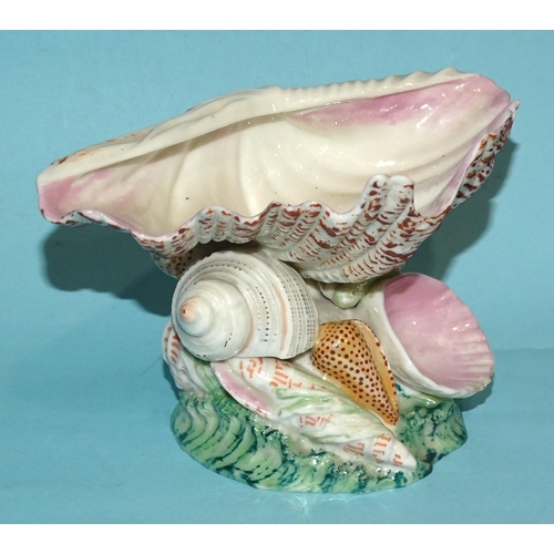 187 - A 19th century Royal Worcester dish in the form of an upturned clam shell, on naturalistic base cove... 