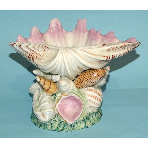 187 - A 19th century Royal Worcester dish in the form of an upturned clam shell, on naturalistic base cove... 