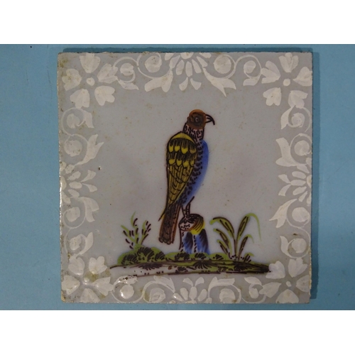 201 - A 19th century ceramic tile decorated with a peregrine falcon, 13cm square and three other antique c... 