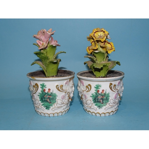 203 - A pair of Continental, 'red anchor' flowerpot ornaments, each floral spray within a planter decorate... 