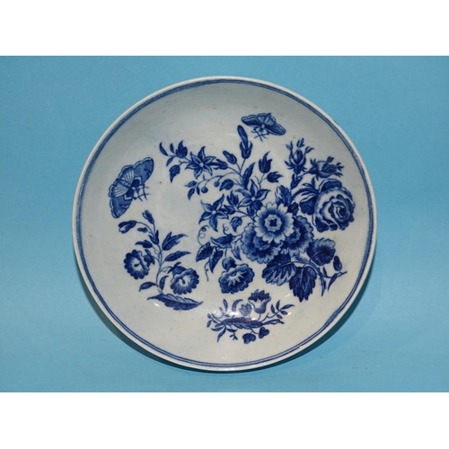 205 - An 18th century Worcester blue and white saucer decorated with floral sprays and butterflies, 12cm d... 