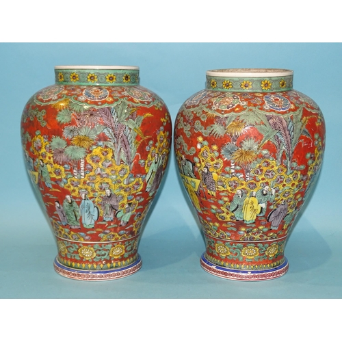 208 - A pair of modern Chinese baluster clobbered vases decorated with numerous figures in a landscape and... 