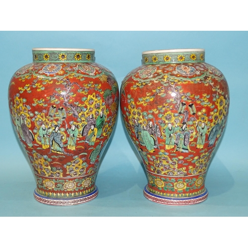 208 - A pair of modern Chinese baluster clobbered vases decorated with numerous figures in a landscape and... 