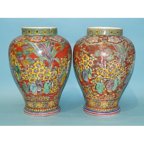 208 - A pair of modern Chinese baluster clobbered vases decorated with numerous figures in a landscape and... 