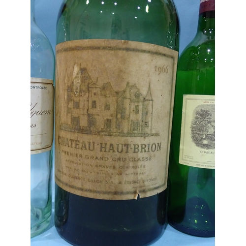 221 - A collection of eight empty wine bottles, well-known labels, including a jeroboam of Chateau Haut-Br... 